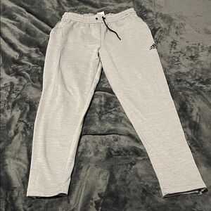 Adidas Light Gray Joggers Men Large. Zipped leg and pockets. Polyester.